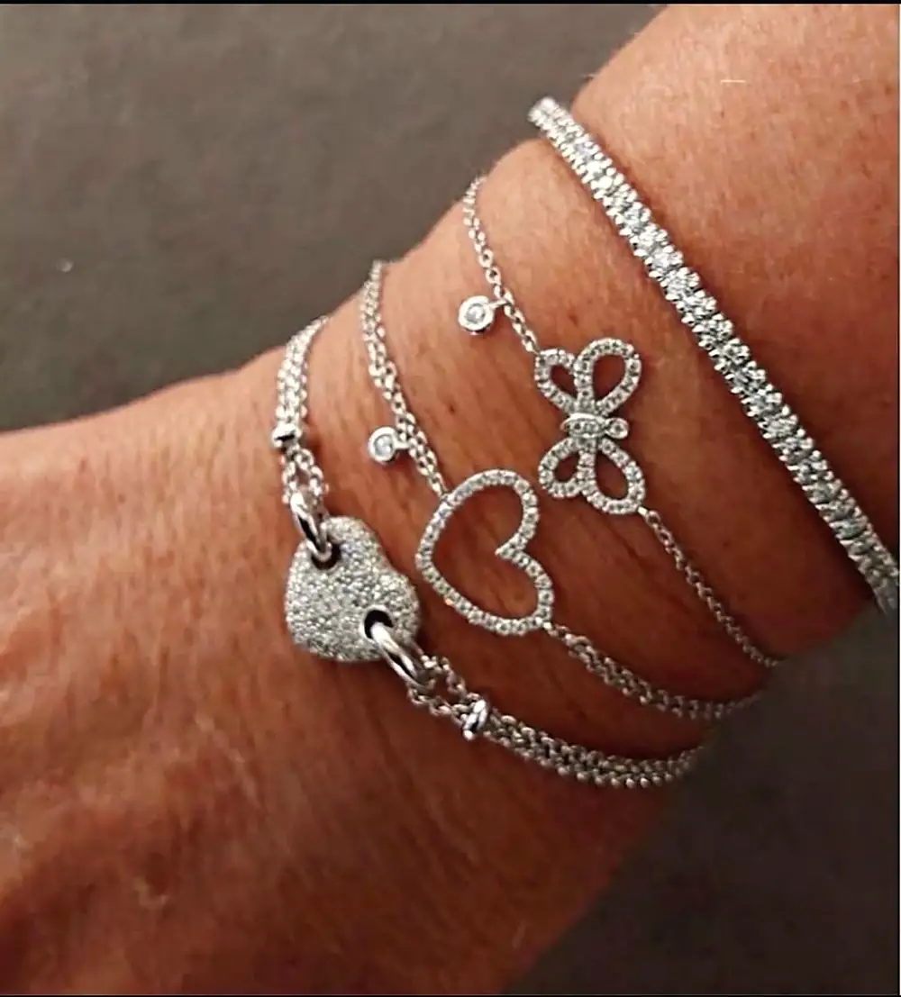 Bracciali in oro bianco con cuore, farfalla e tennis di diamanti